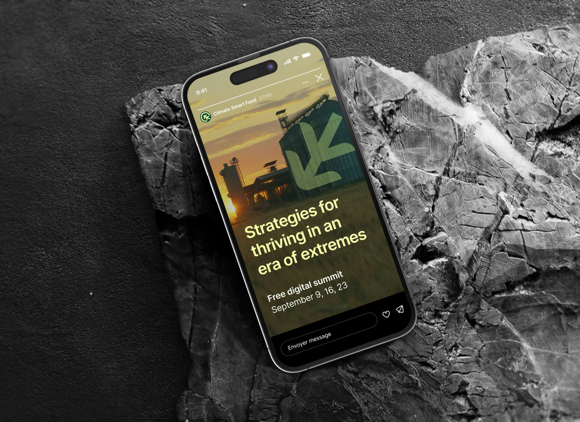 A mobile laid on top of a rock featuring the hero section of the website homepage